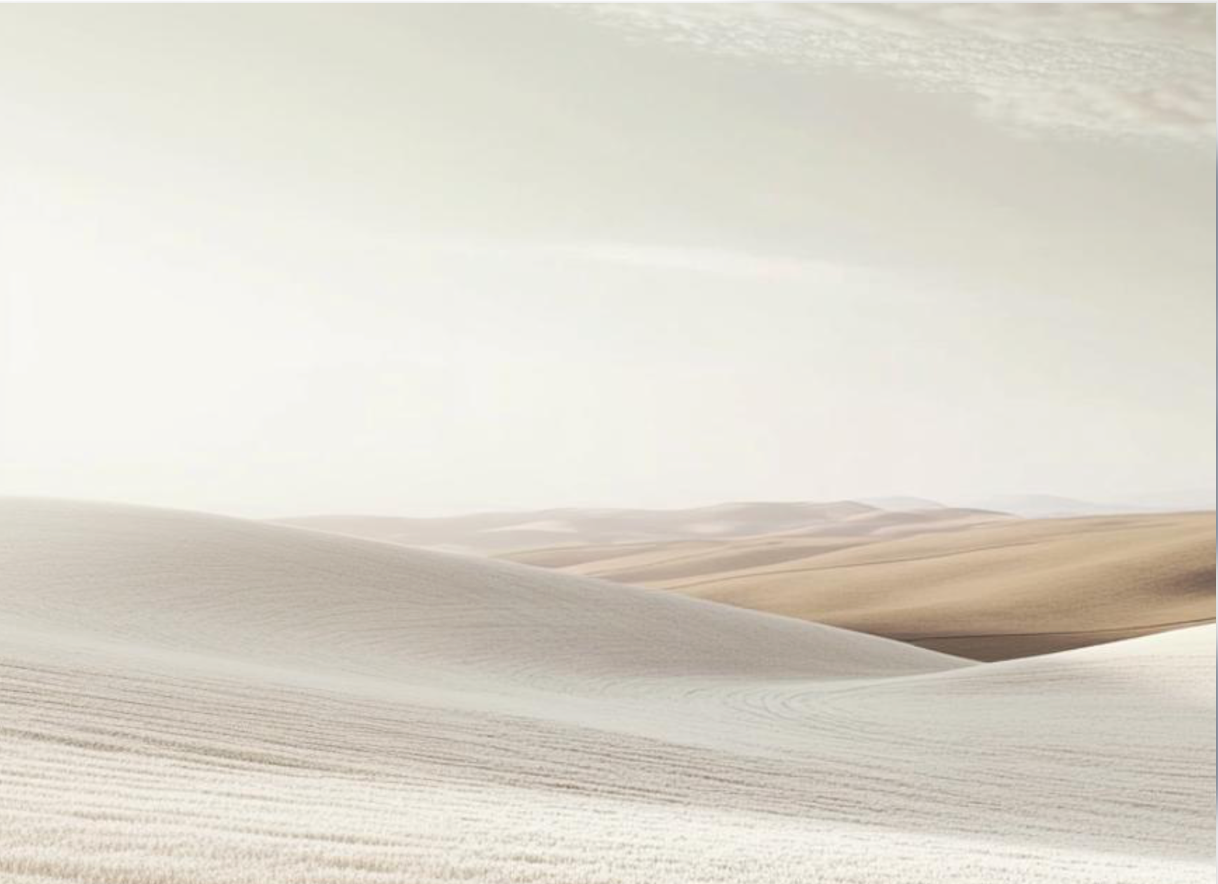 Soft ivory and warm beige sand dunes beneath a pale sky